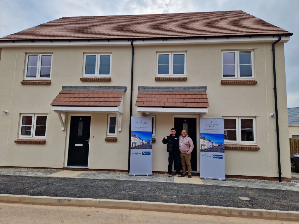 Picture of Homes in Sedgemoor colleagues outside a property in a new development.