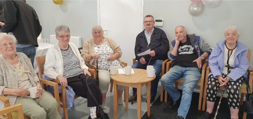 Residents in the communal room at West Bow House